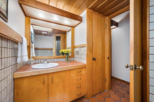 Main level bath with unique wood and tile finishes