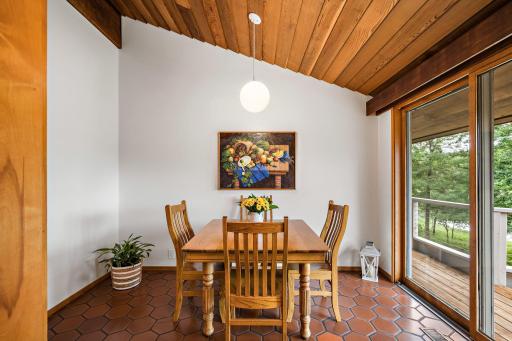 Bright and peaceful - The kitchen’s eating area opens to the deck and is perfect for quiet mornings enjoying peaceful sunrise views.