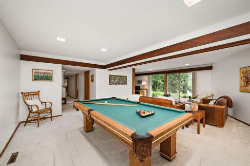 Walkout lower level has expansive recreation area that is open to family room.