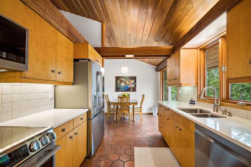 Eat-in kitchen features Quartz Countertops, New Stainless Steel Appliances (including an Induction Range) and New Faucet.