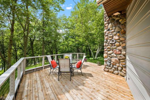 Large deck provides panoramic views and space to entertain or relax in nature.