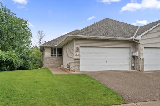 This Plymouth end-unit walkout rambler townhome in the Osseo School District offers spacious living, serene views, and the perfect place to call home.