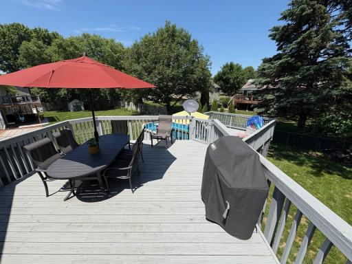 Expansive deck leads to a pool with new side walls, pump, filter and liner