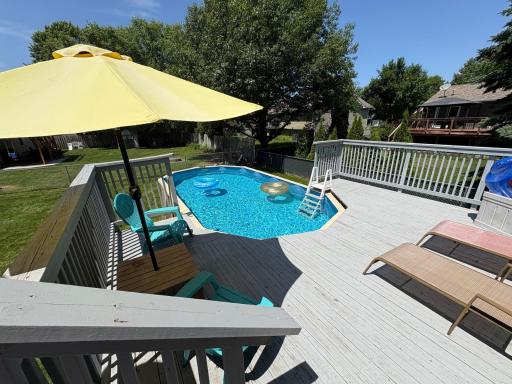 Expansive deck leads to a pool with new side walls, pump, filter and liner