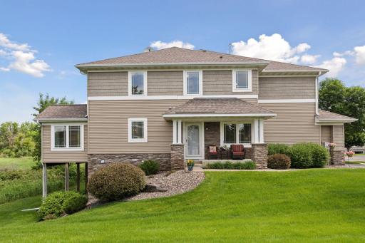 Welcome home to 4985 Archer Lane. Stunning two story townhome in sought after Fields of Nanterre!