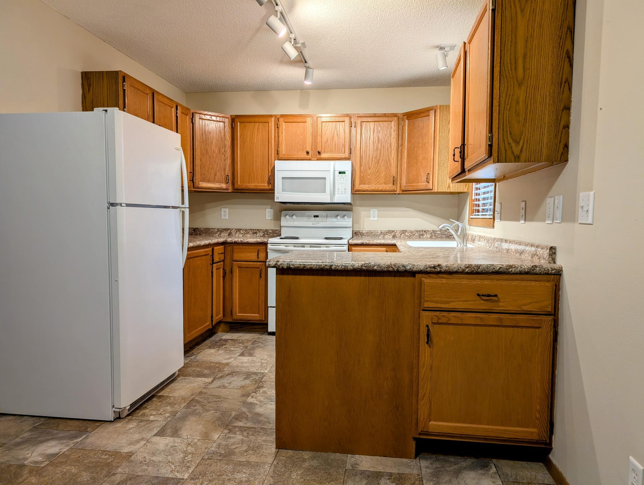 All appliances included in highly functional kitchen.