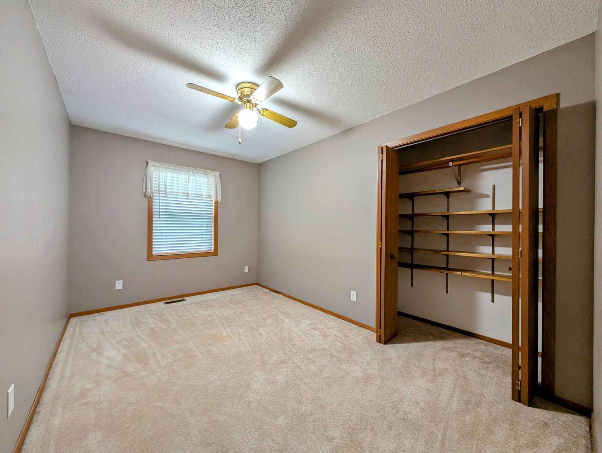 BR #3 currently boast great shelving arrangement in closet ~ was used as office. Note ceiling fan and blinds in each bedroom.