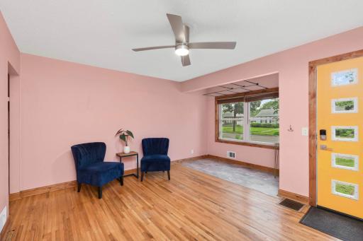 The living room is generous bright with a sweet nook that is a great place for plants.