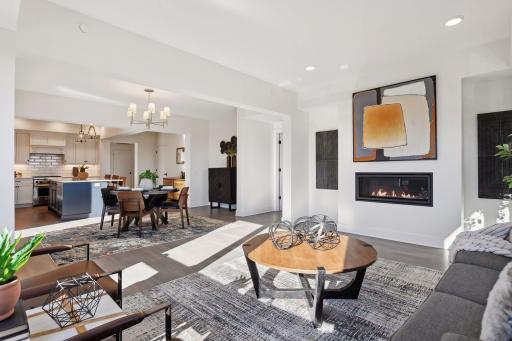 Highlights include a gas fireplace, hardwood floors throughout the main areas, and an open floor plan