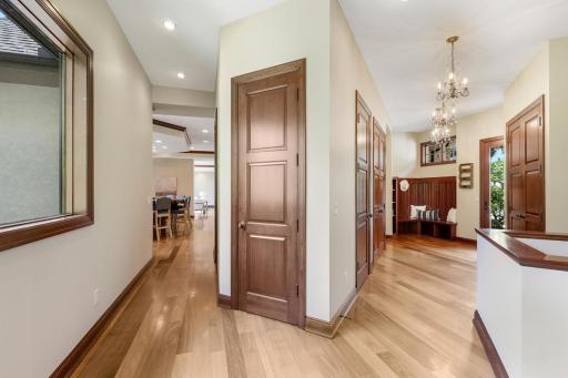 A ½ bathroom that serves the main floor common spaces is conveniently situated between the kitchen and mudroom. A roughed-in elevator shaft, which was included in the build design, is located in the closet next to the north staircase.