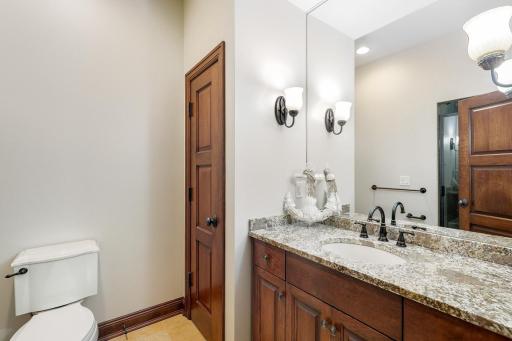 The second bathroom with a step-in shower serves the first and third lower-level bedrooms.