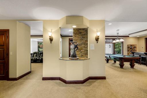Two stairwells lead to the sprawling, walkout, lower level which hosts three generously sized bedrooms and three bathrooms.