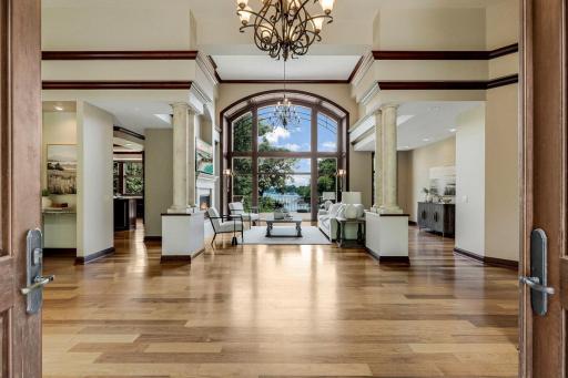 The living room is mostly open to the kitchen and dining room, features a gas fireplace and a magnificent, arched picture window which invites natural light to fill the space.