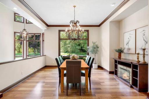 Elegant columns surround the formal dining room which is open and bright with a large picture window.