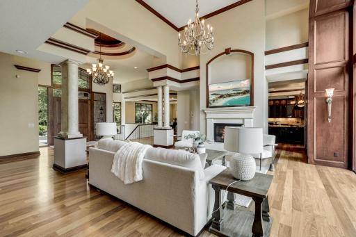 The living room is mostly open to the kitchen and dining room, features a gas fireplace and a magnificent, arched picture window which invites natural light to fill the space.