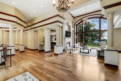 The chef’s kitchen features large windows, a double wall oven, 5-burner gas cooktop, built in microwave, generously sized refrigerator, abundant cabinet storage, 2 center islands and granite countertops.