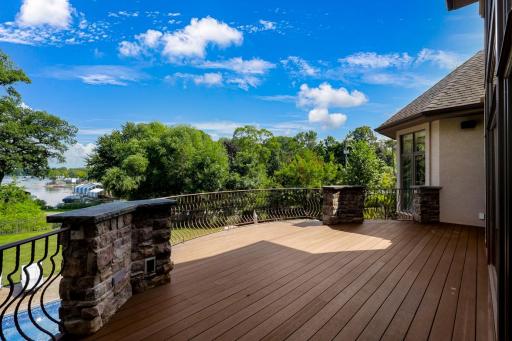 Located just off the kitchen, the large maintenance free deck overlooks the backyard with expansive nature and water views. A natural gas line at the deck supplies the grill.