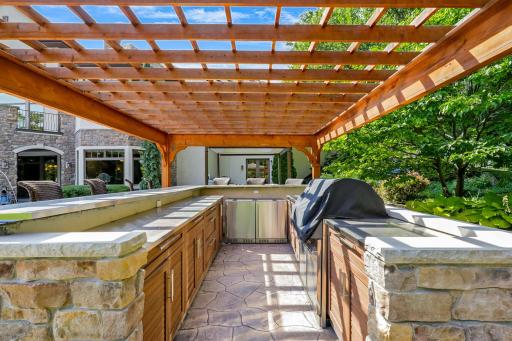 The outdoor kitchen is fully equipped. A natural gas line supplies the cooking station.