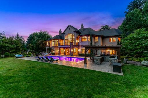 The grounds include numerous additional features, including a wi-fi controlled irrigation system, boulder retaining walls, and perfectly manicured plant life.