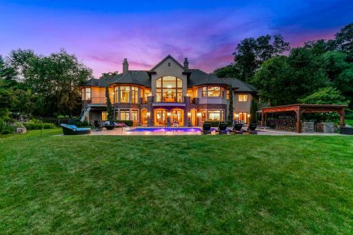 The grounds include numerous additional features, including a wi-fi controlled irrigation system, boulder retaining walls, and perfectly manicured plant life.