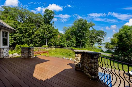 Located just off the kitchen, the large maintenance free deck overlooks the backyard with expansive nature and water views. A natural gas line at the deck supplies the grill.