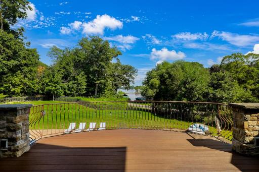 Located just off the kitchen, the large maintenance free deck overlooks the backyard with expansive nature and water views. A natural gas line at the deck supplies the grill.