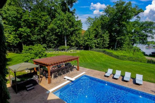 Located just off the kitchen, the large maintenance free deck overlooks the backyard with expansive nature and water views.