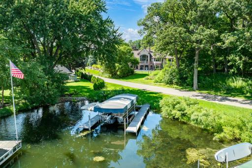 W Lafayette Road, a quiet, small, dead-end street that serves only eight other homes with very minimal traffic, separates the home from the lakefront.