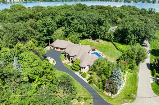 The 1.4-acre, resort-like estate is completely framed by mature trees, providing the perfect blend of privacy, serenity, nature, and endless options for entertainment.