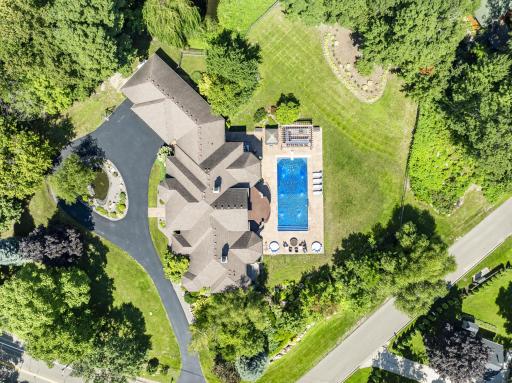 The 1.4-acre, resort-like estate is completely framed by mature trees, providing the perfect blend of privacy, serenity, nature, and endless options for entertainment.