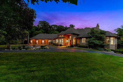 A unique blend of classic architecture with modern design, this stately home was strategically positioned on the spacious acreage lot to maximize privacy, flat, usable yard space, natural daylight, sunrises over the lake.