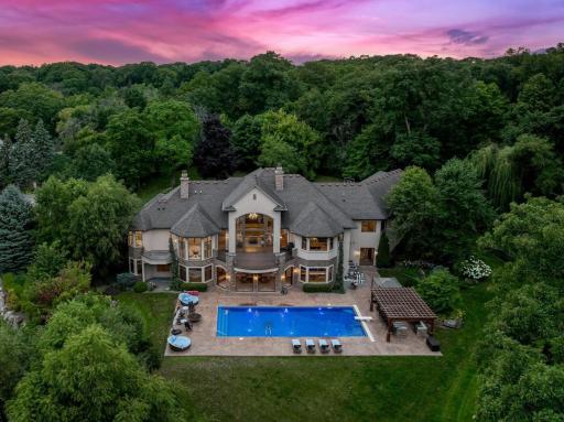 The grounds include numerous additional features, including a wi-fi controlled irrigation system, boulder retaining walls, and perfectly manicured plant life.