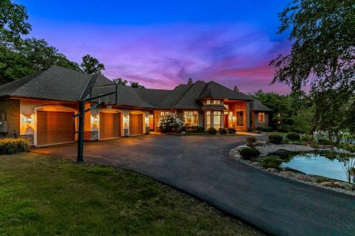 The loop driveway allows for easy flow to and from the property, plenty of room to park guests, and a flat, sport court area with a basketball hoop.