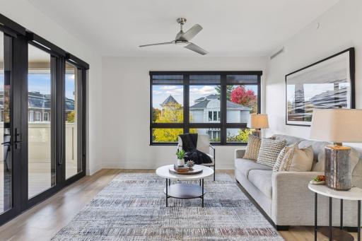 The sun room provides additional gathering space for morning coffee and quiet conversations, plus access to the covered balcony