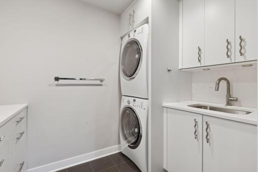 Functional laundry room with sink and storage