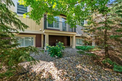 A rear perspective showcasing the back of the property. A well-maintained outdoor space with a clear view of the deck