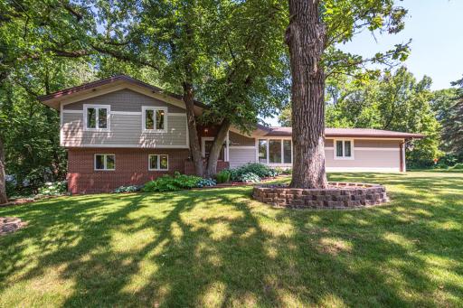 EXTENSIVE UPDATES bring fresh and classic style to this 4BR 3BA Bloomington home tucked onto a mature-treed lot! Exterior updates include NEW SIDING, ROOF, GUTTERS, SOFFIT, FASCIA, EXTERIOR LIGHTING, PELLA WINDOWS, STORM DOORS and more!