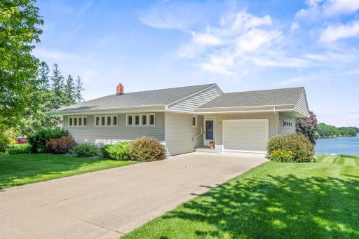 Front of home with large concrete driveway
