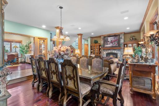 Formal Dining Room sunken from main hallway. Office, entry and living room are shown in background. Ceiling speakers part of whole house audio.