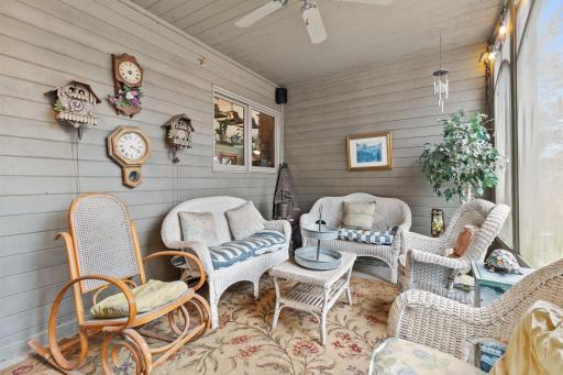 Screened in porch showing pass through to kitchen.