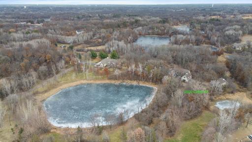 View looking north showing larger pond and house labeled on right side.