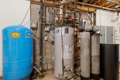 Main and lower lever level mechanical room. High-flow (20+ gpm) well delivers plenty of pressure and flow. Recent Lenox HVAC. Boiler for radiant heat for the attached garage and supplemental heat for lower level.