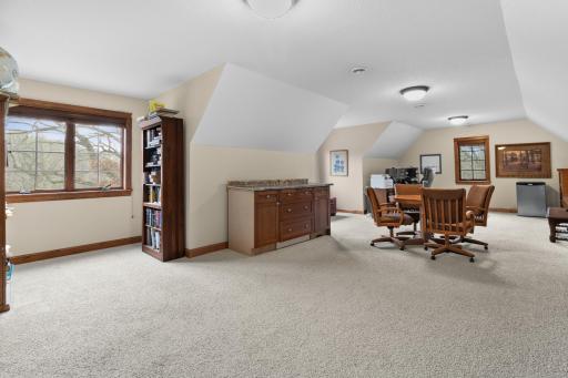 Upper-level bonus room or private office. Large 30' x 18' area is above attached garage and access from back stairway from main level hallway. Be sure not to miss this during showing. Wired LAN available.