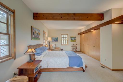 The clear maple closet doors were custom made. The cherrywood soffits bring that soft warm light seen throughout the home.