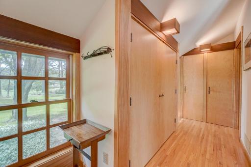 There is abundant closet space in this vestibule off the entryway.