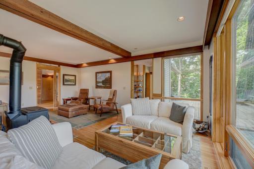 The soft-lit cherry soffits carry a congruity of design throughout the home.