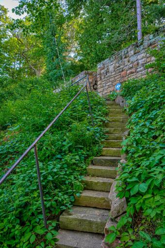 Cold Stone Shorelines reinforced the stone retaining wall, rebuilt large portions of the steps to the waterfront, and added a second staircase from the north side of the yard.