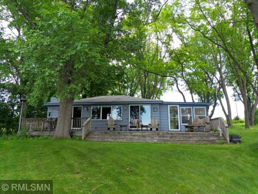 Nestled at the end of a quiet road on the shores of Mink Lake, this beautiful one-level home offers ultimate privacy and an authentic Northwoods feel.