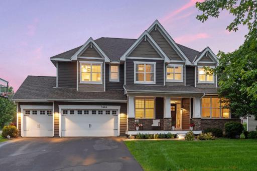 Stunning home features maintenance free LP siding w/ shake & stone accents.