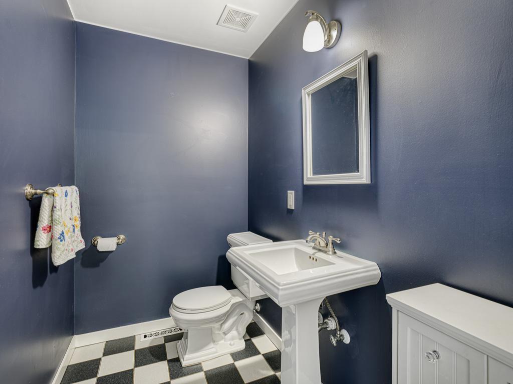 Guests will appreciate the main-level powder room, combining style and function